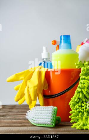 Bucket with cleaning items on light background Stock Photo