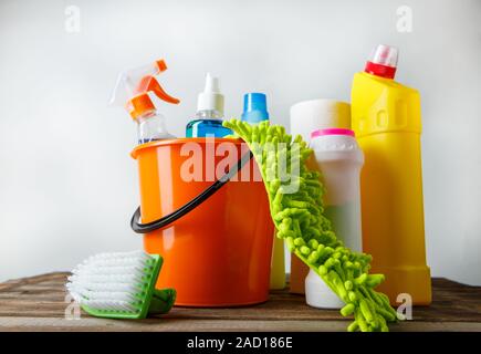 Bucket with cleaning items on light background Stock Photo