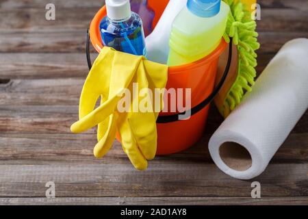 Yellow Bucket With Cleaning Supplies Isolated On White Background