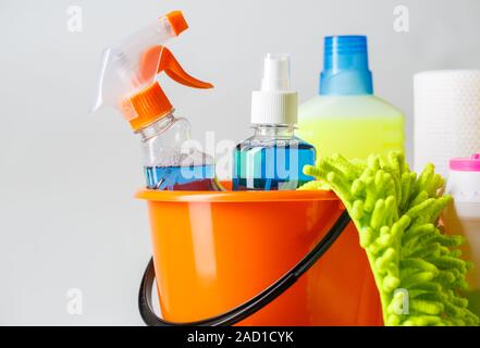 Bucket with cleaning items on light background Stock Photo
