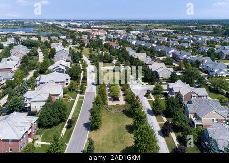 Aerial view of a neighborhood in suburban Chicago with homes on either side of a parkway. Stock Photo