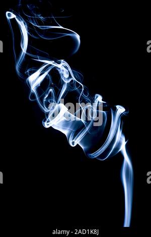 Blue smoke on black background Stock Photo