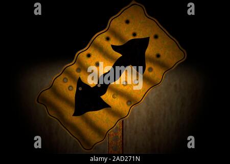 A lopsided and warped road sign with bullet holes. Stock Photo