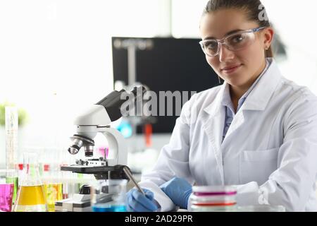 Smiling biomedical researcher in eyewear Stock Photo
