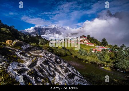 Tengboche Gompa with snow-covered Mt. Kongde Ri in the distance, monsoon clouds rising up Stock Photo