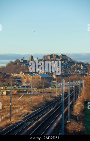 Electrified train tracks leading towards Stirling Castle, Scotland. Stock Photo