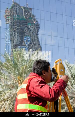 A surveyor working on a construction project in Dubai. Stock Photo