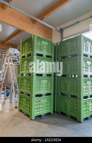 Crates stacked on top of each other in an industrial building. Stock Photo
