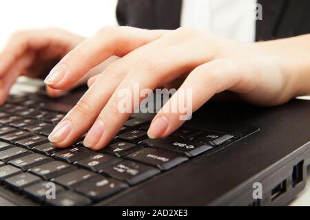 Woman hands typing on laptot, close-up, isolated Stock Photo