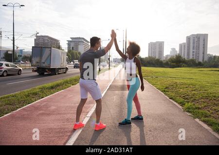 couple congratulating on morning run ginis Stock Photo