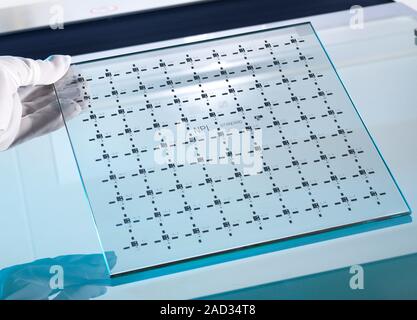 Co-ordinate measuring machine standard. Close-up of a researcher holding an optical dimensional artefact, a standard device used to test and calibrate Stock Photo