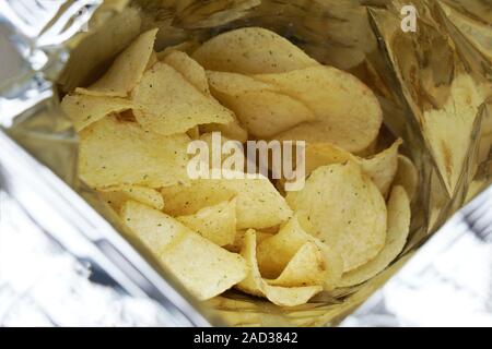 close-up look inside a bag of potato chips or packet of crisps, cheese and onion flavor Stock Photo