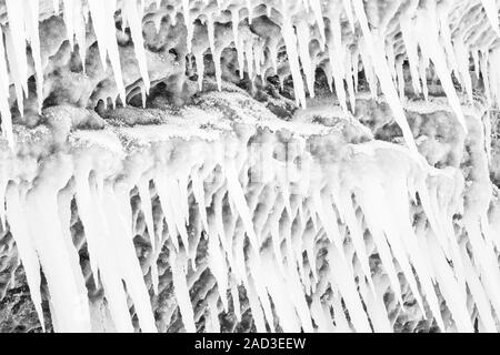 Icicles on a rock, Lake Tornetraesk, Lapland, Sweden Stock Photo