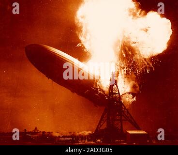 Hindenburg disaster, coloured image. View of the German airship Hindenburg (LZ 129) on fire over Naval Air Station (NAS) Lakehurst, New Jersey, USA, o Stock Photo