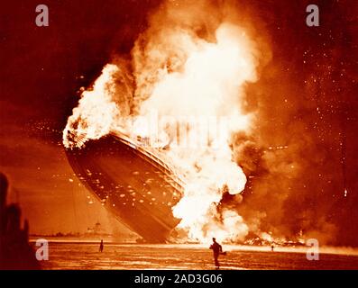 Hindenburg disaster, coloured image. View of the German airship Hindenburg (LZ 129) on fire as it crashes at Naval Air Station (NAS) Lakehurst, New Je Stock Photo