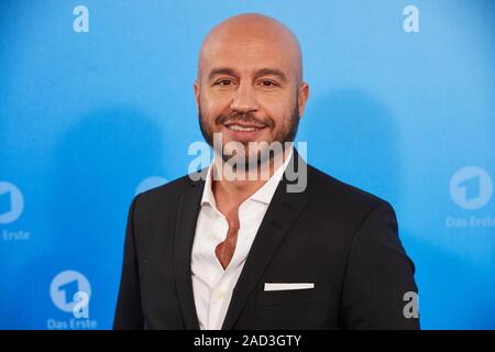 Hamburg, Germany. 03rd Dec, 2019. Dar Salim, actor, stands in front of a logo wall at a photo shoot on the occasion of the ARD annual press conference. Credit: Georg Wendt/dpa/Alamy Live News Stock Photo