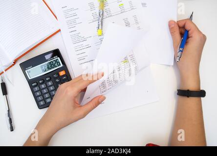 Accountant with reports on table Stock Photo