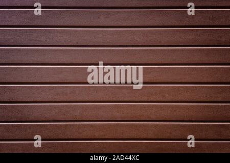 brown plastic fence panels in horizontal stripe texture background Stock Photo