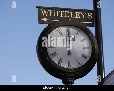 Large clock with sign for Whiteleys famous department store in Queensway, London, UK Stock Photo