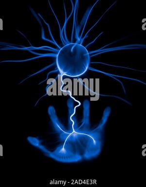 Light streamers inside a plasma globe discharging towards a hand, blue positive image. A plasma globe is a glass sphere filled with a gas at low press Stock Photo