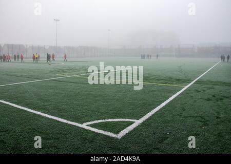 South Lanarkshire, Scotland, UK. 30th November 2019: A youth football game on a foggy day Stock Photo