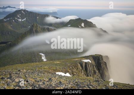 Foggy mood in the mountains, Flakstadsoeya, Lofoten, Norway Stock Photo