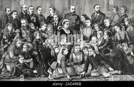 Queen Victoria and her family, 1870s group portrait. Queen Victoria (centre, 1819-1901) with her nine children (four sons and five daughters), two dau Stock Photo