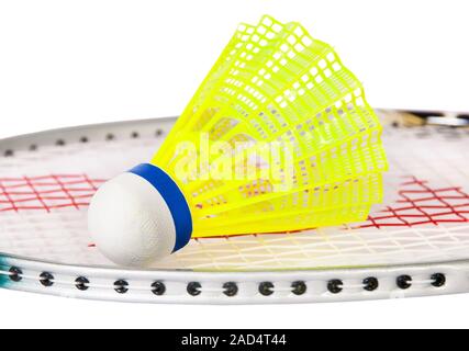 Shuttlecock lying on the badminton racket Stock Photo