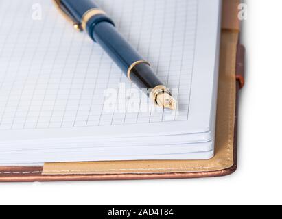 Closeup fountain pen on top of the open notebook Stock Photo