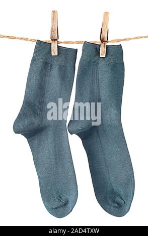 Dark blue socks on rope with clothespins Stock Photo
