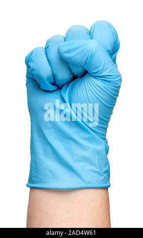 Hand in latex glove clenched into a fist Stock Photo