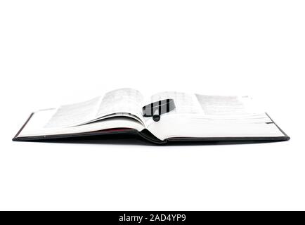 Open Book with Magnifier isolate on white Background Stock Photo