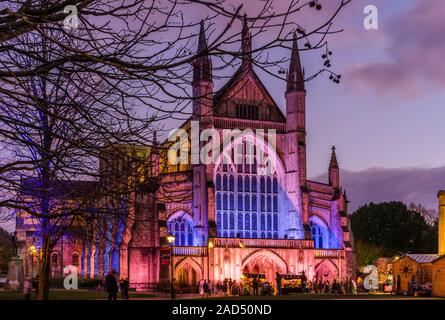 Winchester Cathedral illuminated in festive colours during the Annual Winchester Christmas market in December 2019, Winchester, Hampshire, England, UK Stock Photo