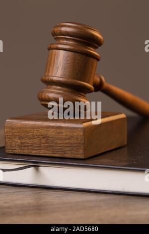 Photo of hammer on book Stock Photo
