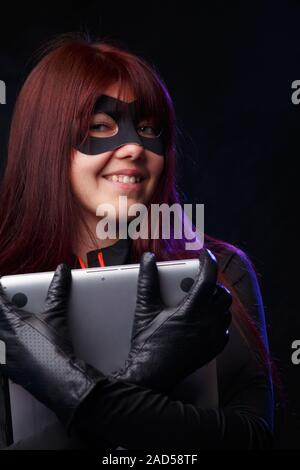 Beautiful thief in black gloves Stock Photo