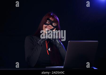 Night hacker in black mask Stock Photo