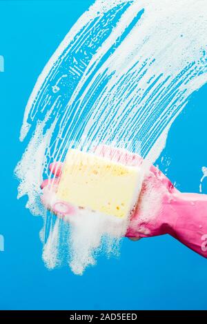 Man washes glass with sponge Stock Photo