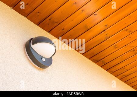 Modern wall lamp with motion and light sensor on the wall Stock Photo