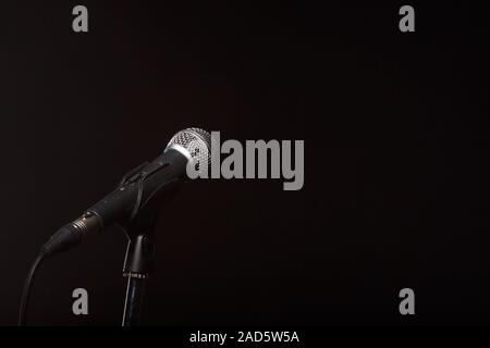 Microphone on empty black background Stock Photo