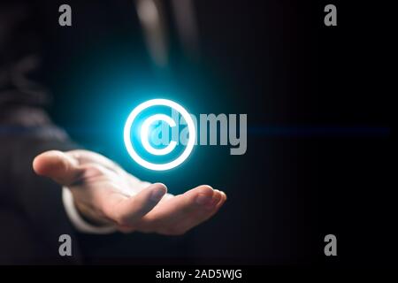 Man holds patent mark ,copyright Stock Photo