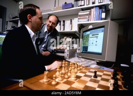 Deep Blue IBM developers Murray Campbell (left) and chess grandmaster Joel Benjamin (right) working on programming Deep Blue to play chess openings. T Stock Photo