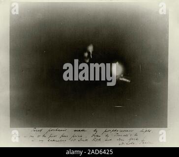 Phosphorescent light photograph of Tesla. Inscribed photograph of Serb-US physicist and electrical engineer Nikola Tesla (1856-1943), with the inscrip Stock Photo