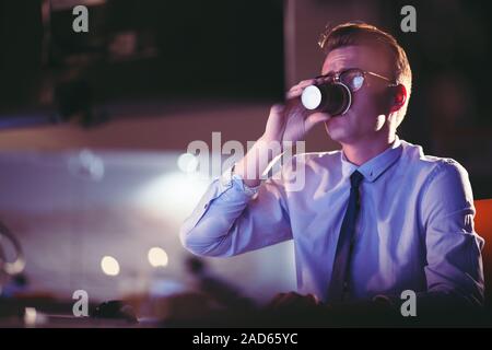 Tired Businessman working late Stock Photo