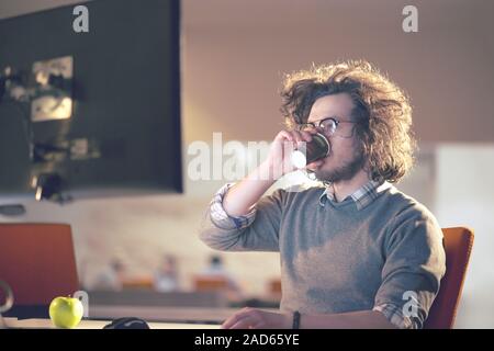 Tired Businessman working late Stock Photo