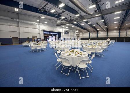 Large dual-purpose  Banquet hall facility being set up for a banquet. Stock Photo