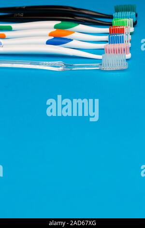 Multi colored toothbrushes on top Stock Photo