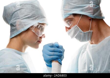 Doctors in uniform make handshake Stock Photo