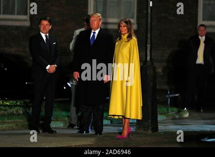 U.S. President Donald Trump and first lady Melania stand with Italian Prime Minister Giuseppe Conte as they arrive for an evening reception for Nato leaders hosted by Prime Minister Boris Johnson at 10 Downing Street London, as Nato leaders gather to mark 70 years of the alliance.