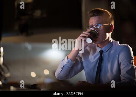 Tired Businessman working late Stock Photo