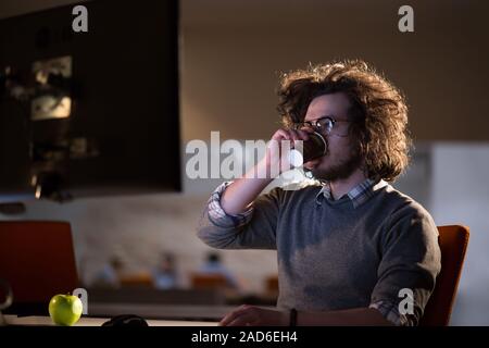 Tired Businessman working late Stock Photo